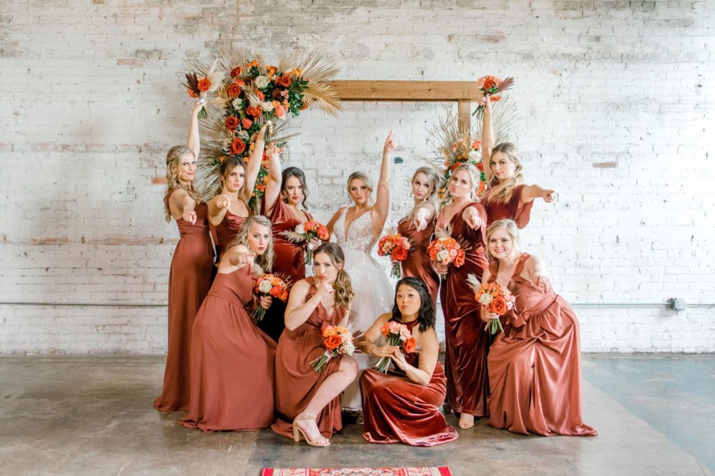 bridesmaids posing with bride